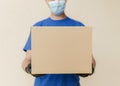 close up delivery man holding box. High quality beautiful photo concept Royalty Free Stock Photo