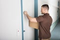 Delivery Man Knocking The Door Royalty Free Stock Photo