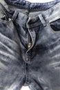 Close-up denim pants, open zipper, pockets, belt loops, shabby denim fabric texture Royalty Free Stock Photo