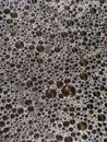 close-up of dense bubbles on a dark liquid surface Royalty Free Stock Photo