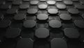 Close-up of dense hexagonal pattern in dark grey. Repeating geometric shapes create textured surface with subtle highlights. Royalty Free Stock Photo