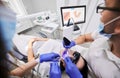 Doctor scanning patient mouth with modern intraoral scanner. Royalty Free Stock Photo