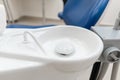 Close-up dentist sink. Dental work in clinic. Operation, tooth replacement. Medicine, health, stomatology concept