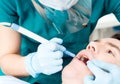 Close up of dentist treat a man teeth