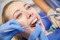 Close up of dentist treating female patient teeth Royalty Free Stock Photo