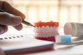 Close up Denture with toothpaste Toothbrush on blurred background.Metaphor for oral, dentures jaw toothy healthcare protect Royalty Free Stock Photo