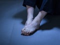 Close-up of depressed man's feet