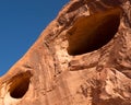A close-up of desert rock with holes caused by erosion Royalty Free Stock Photo