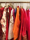 Close up of designer indian garments for woman displaying on the rack.