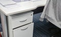 Desk drawer and office desk with jacket on chair