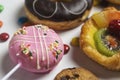 Close up of dessert with candy, chocolate and strawberry donuts and fruitcake Royalty Free Stock Photo