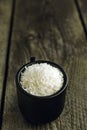Dessicated Coconut flakes in a small cup
