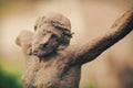 Close up destroyed ancient iron statue of the crucifixion of Jesus Christ