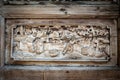 Close-up detail of ancient classic wooden door panel decorated with typical Chinese architecture style pattern and woodcarving Royalty Free Stock Photo