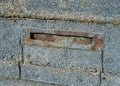 Close-up detail of an antique mail hole