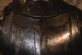 Close up detail Background with armour of the medieval knight. Metal protection of the soldier. Steel Plate. Rivets and engraving Royalty Free Stock Photo