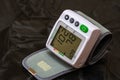 Close up, detail of blood pressure cuff monitor isolated. Digital blood pressure measuring device. Bucharest, Romania, 2020 Royalty Free Stock Photo