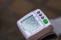 Close up, detail of blood pressure cuff monitor isolated. Digital blood pressure measuring device. Bucharest, Romania, 2021 Royalty Free Stock Photo