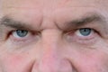 Close up detail on the blue eyes of a mature man Royalty Free Stock Photo