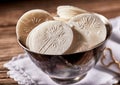 Close up detail of a bowl of sacramental Hosties