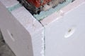 Close-up detail of brick house wall with rigid styrofoam insulation sheet. Modern technology of construction, renovation and Royalty Free Stock Photo