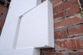 Close-up detail of brick house wall with rigid styrofoam insulation sheet. Modern technology of construction, renovation and Royalty Free Stock Photo