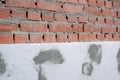 Close-up detail of brick house wall with rigid styrofoam insulation sheet. Modern technology of construction, renovation and Royalty Free Stock Photo