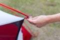 Close up detail of camping tent. Aluminum tent poles. Process of installing tent, setting up tent outdoors