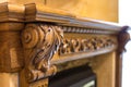 Close-up detail of carved wooden decorative piece of furniture with floral ornament made of natural hardwood. Art craft and design Royalty Free Stock Photo