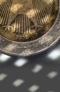 Close Up and detail of a Consumes Used and Ruined Two Euro Coin