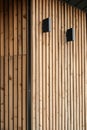 close up detail of dark grey alucobond cladding on the roof, wood slats behind it, contemporary architecture Royalty Free Stock Photo