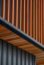 close up detail of dark grey alucobond cladding on the roof, wood slats behind it, contemporary architecture Royalty Free Stock Photo