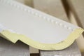 Close-up detail of decoration molding with glue adhesive before installation in interior renovation. Royalty Free Stock Photo