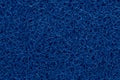 Close-up detail deep classic blue plastic doormat texture. Neutral abstract backdrop surface. Color of the year 2020 Royalty Free Stock Photo