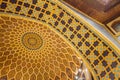 Close-up detail of the dome ceiling with yellow, brown and blue tiles decorated in Arabic style at department store in Dubai Royalty Free Stock Photo