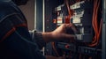 Close up detail of an electrician hands working with wires and fuse switch box Royalty Free Stock Photo