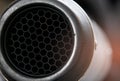 Close-up detail exhaust pipe of big bike. Hexagon unique pattern of racing motorcycle exhaust pipe. Motorbike parts. Accessories Royalty Free Stock Photo