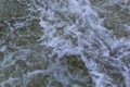 Close up detail of fierce white water river rapids from a clean deep green colored river forming a textured background Royalty Free Stock Photo