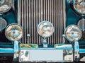 Close up detail with the front part and the headlights of an old vintage car Royalty Free Stock Photo