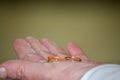 Close-up detail of the hand with two wedding rings. Royalty Free Stock Photo