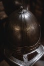 Close up detail of helmet, armour of the medieval knight. Metal protection of the soldier. Steel Plate. Rivets and engraving, dark Royalty Free Stock Photo