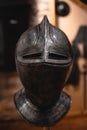 Close up detail of helmet, armour of the medieval knight. Metal protection of the soldier. Steel Plate. Rivets and engraving, dark Royalty Free Stock Photo
