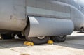 Close up detail with a landing gear of a large cargo airplane. Aircraft tires wheels