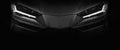 Detail of the LED headlights super car on black background Royalty Free Stock Photo