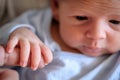 Close-up detail macro view of baby holding on to mom`s finger with his little hand Royalty Free Stock Photo