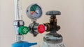 Close-up detail of medical oxygen tank with regulating valve