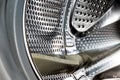 Close up detail of modern dirty or clean washing machine interior with open door interior. Silver shiny stainless drum Royalty Free Stock Photo