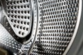 Close up detail of modern dirty or clean washing machine interior with open door interior. Silver shiny stainless drum Royalty Free Stock Photo