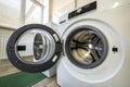 Close-up detail of modern washing machine interior with open door interior. Silver shiny stainless drum, design and technology Royalty Free Stock Photo