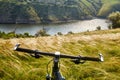 Close-up of detail of the mountain bicycle on the green grass.